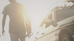 Tranquil vibe on ocean beach. Asian man surfer with sunglasses takes a surf board from a green vintage car in the parking lot. Male surfs at sunset. Retro vibe, hawaii or bali - Powered by Shutterstock - Get 15% off with code: PIKWIZARD15