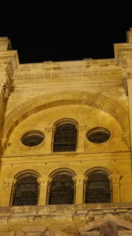 large windows malaga cathedral featured illuminated beautifully night architectural elegance historic church close up side panning shot close-up scene urban experience