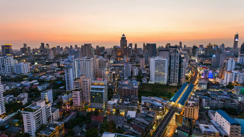 BANGKOK - 30 MARCH: Time lapse view of Bangkok skyline at sunset. Top view of