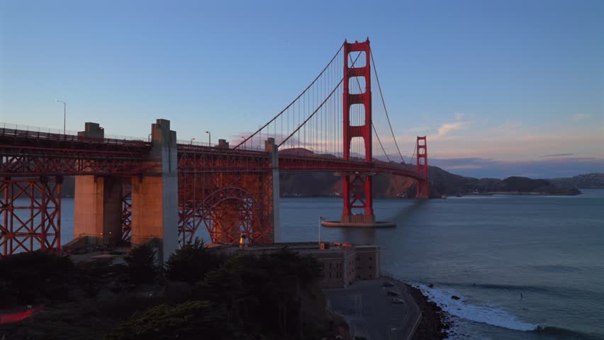 Surfing Golden Gate Bridge San Fransisco California at Bay Area Fort Point National Historic site Battery vista point sunset dusk Welcome Center Pacific Ocean birds in V flight static shot