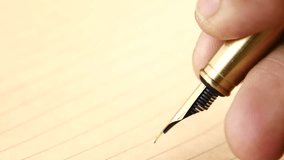 closeup of writing with a fountain pen on a paper  - Powered by Shutterstock - Get 15% off with code: PIKWIZARD15