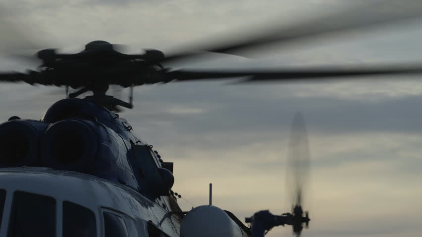 Helicopter propellers and turbines. Helicopter's main rotor is spinning. Close-up