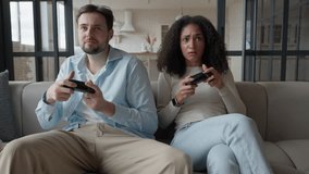 Happy Young People Playing Video Games on Console While Sitting on Couch  - Powered by Shutterstock - Get 15% off with code: PIKWIZARD15