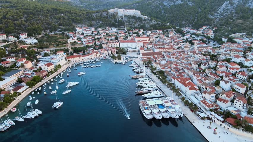 Aerial: Flying over Hvar island in Croatia. Shot in Mediterranean coastline.