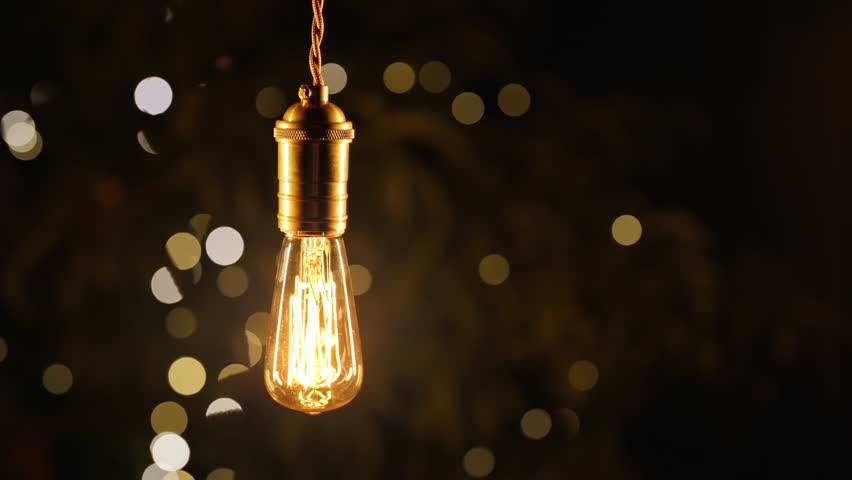 Decorative Old Edison Tungsten Filament Lamp Hanging Outdoors In Garden, Glowing