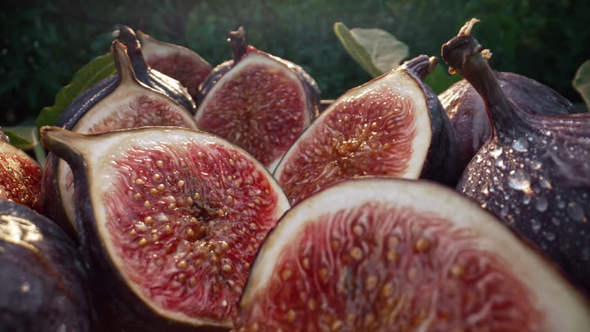 Camera Moves Between Sliced Halves, Healthy Juicy Ripe Figs. Dolly Slider Macro 