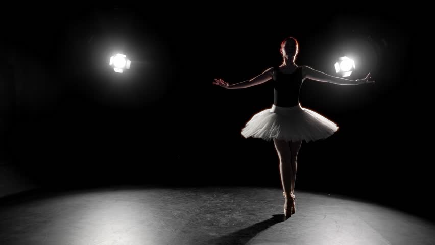 Ballerina rehearsing alone overnight, silhouette of graceful lady in darkness. Beauty and grace of professional ballet dancer girl, tenderness of young woman performing classical choreography, slowmo