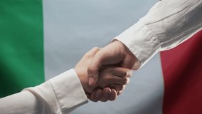 Italian Man Woman Business Partners Shaking Hands. Handshake, Make Deal, Italy - Powered by Shutterstock - Get 15% off with code: PIKWIZARD15