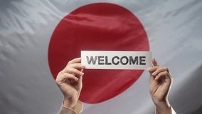 Woman - Welcome Lettering Title Text Cardboard Japanese Flag Backdrop. Japan - Powered by Shutterstock - Get 15% off with code: PIKWIZARD15