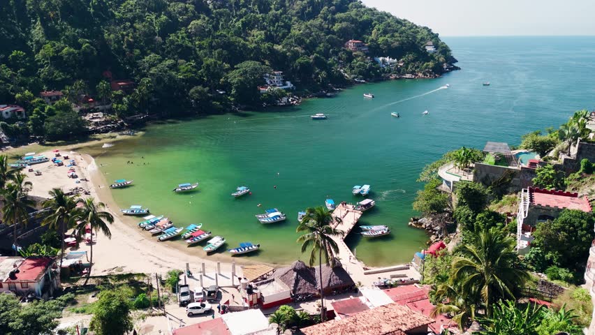 Mexican coastline on the Pacific Ocean surrounded by water taxi coming and going. Puerto Vallarta, Jalisco