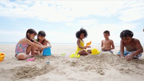 Happy Children travel playing at the sea on summer beach holiday vacation. Group of Little cute child boy and girl kids enjoy and fun outdoor lifestyle playing beach toy build sand castle on the beach - Powered by Shutterstock - Get 15% off with code: PIKWIZARD15