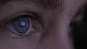 Child in Dark is Watching TV Playing Video Game. Close-up Face of Little Girl Kid Eyes. Girl Watch Television on Living Room. Video Game Entertainment Addiction Child Using Tablet, Smartphone Computer - Powered by Shutterstock - Get 15% off with code: PIKWIZARD15