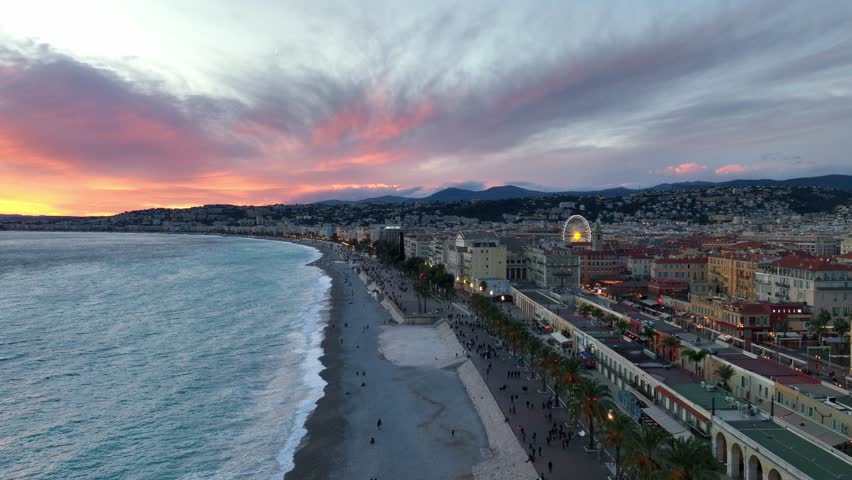 Romantic sunset in Nice, drone view of beach in Nice on Cote d'Azur, holiday in French Riviera, Nice coastline, travel in south of France