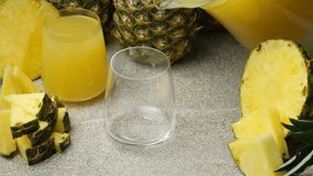 Pineapple juice pour into a glass, slow motion - Powered by Shutterstock - Get 15% off with code: PIKWIZARD15