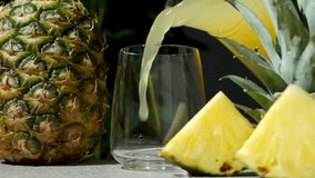Pineapple juice pour into a glass, slow motion - Powered by Shutterstock - Get 15% off with code: PIKWIZARD15