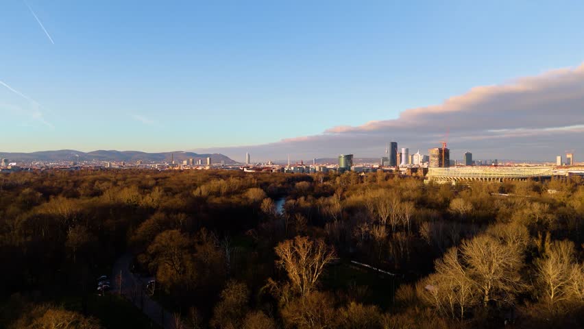 Vienna, Austria Aerial View: Sunset Over City Center and Canal. Top cinematic aerial view. 4K drone footage
