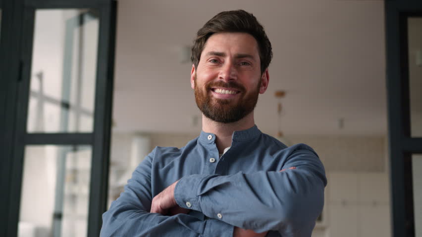 Confident positive Caucasian guy parent feeling happy adult man portrait smiling middle-aged father businessman male dad posing looking at camera at home indoor house owner cross arms insurance credit