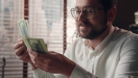 Joyful Caucasian businessman guy trader executive boss counting money savings banknotes in office worker smile accountant male calculate company profit business man dollars cash wages salary earnings - Powered by Shutterstock - Get 15% off with code: PIKWIZARD15