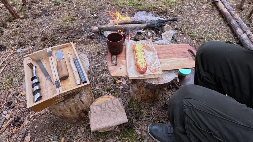 Tourist cooking food in the forest camping