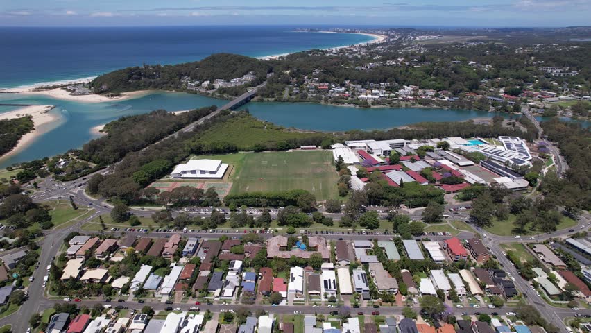Currumbin Creek Mouth On Coral Sea Coast In Palm Beach, Queensland, Australia. aerial panning shot