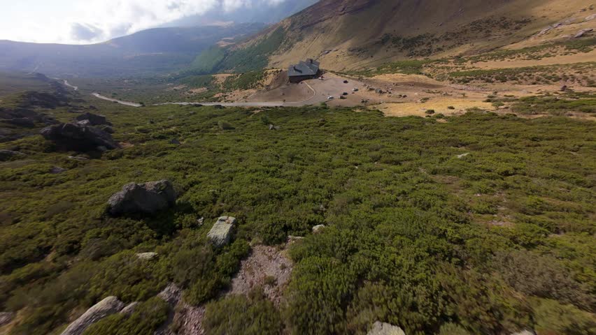 Dynamic Aerial Drone Shot between montains in Cantabria.