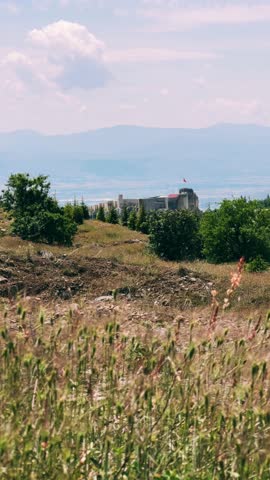 Harput fortress with the Turkish flag, in the spring in Eastern Anatolia, Elazig, Turkey. Harput Castle or Harberd, also known as Sut Kalesi. Ancient city. 4К