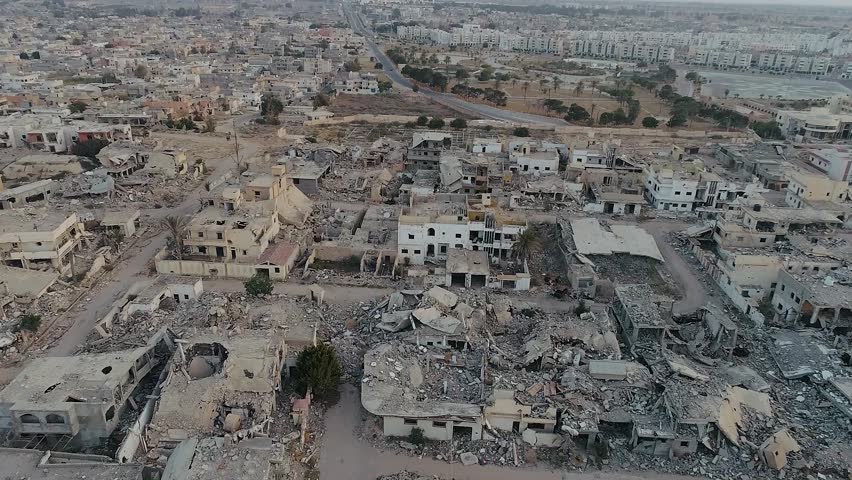 Aerial view of a devastated city. A neighborhood destroyed by war, located next to the sea. The war against terrorism. The city is Sirte, Libya