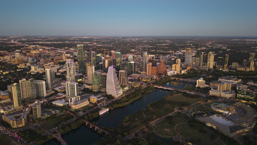 Wide aerial view overlooking the downtown Austin cityscape, sunset in TX, USA