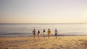 Happy man and woman travel ocean on summer beach holiday vacation. Group of Asian people friends enjoy and fun outdoor lifestyle travel nature playing in the sea together at tropical island beach. - Powered by Shutterstock - Get 15% off with code: PIKWIZARD15