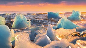 Icebergs Shining During Golden Hour, Sunrise on Diamond Beach in Iceland, Clear Ice Crashed by Ocean Waves - Powered by Shutterstock - Get 15% off with code: PIKWIZARD15