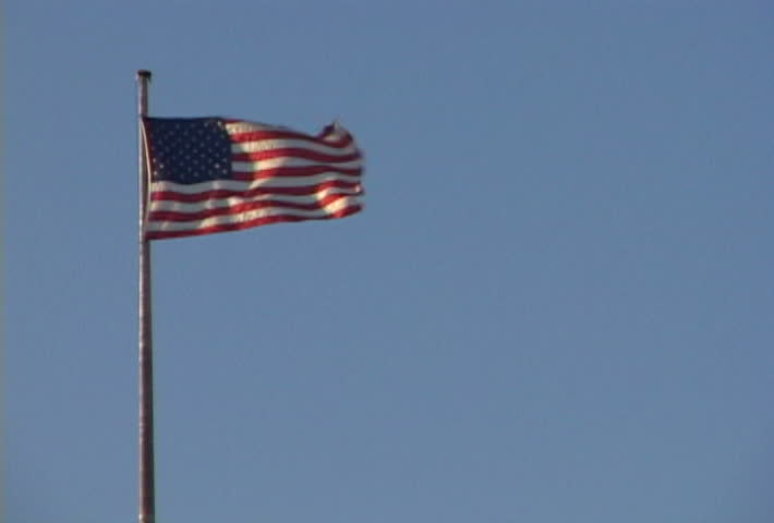 USA Flag waves in wind.