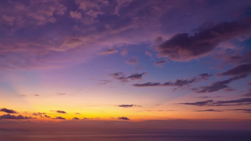 High quality 4K Time lapse of Majestic sunset or sunrise landscape Amazing light of nature cloudscape sky and Clouds moving away rolling 4k colorful sunset light dramatic clouds,Footage sky timelapse