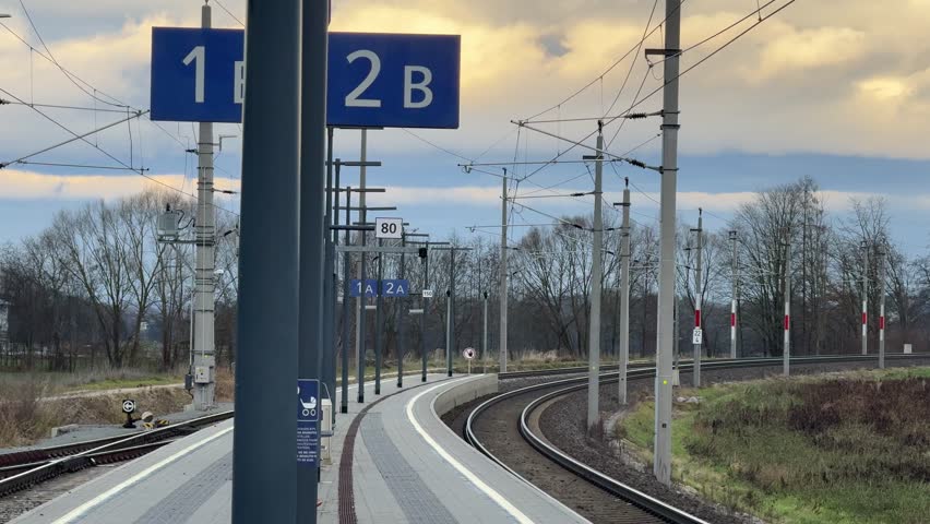 platform on rural trainstation with curved rails