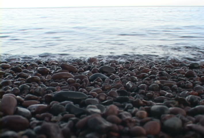 Lake Superior scenic with rocks and waves crashing softly.