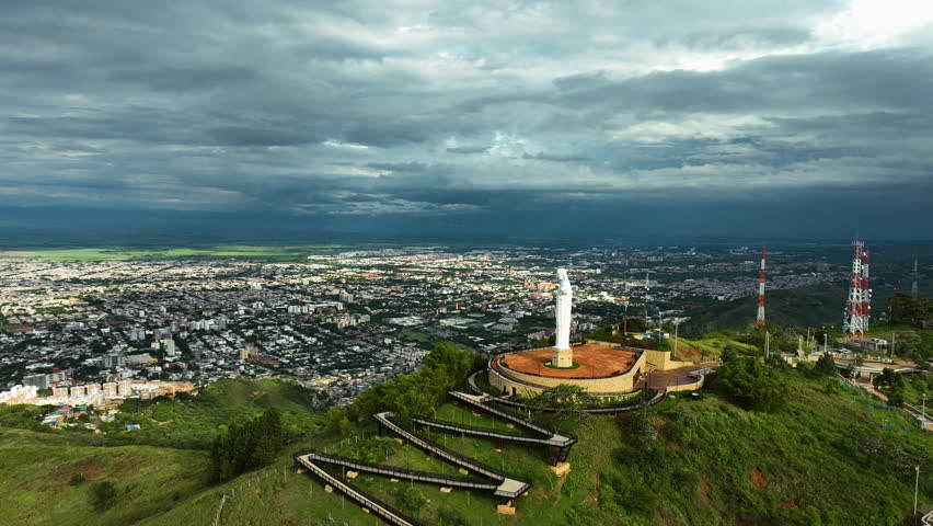 Panoramic drone shot circling the Cristo Rey monument in Cali, Colombia