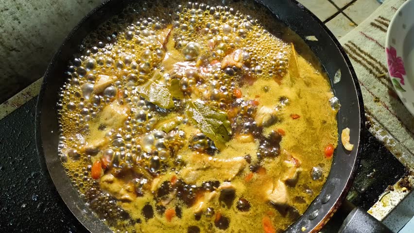 Stewing chopped pork with sauce in pan, in door  Chiangmai  Thailand.