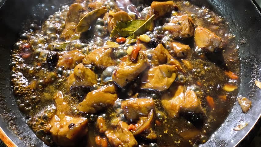 Stewing chopped pork with sauce in pan, in door  Chiangmai  Thailand.