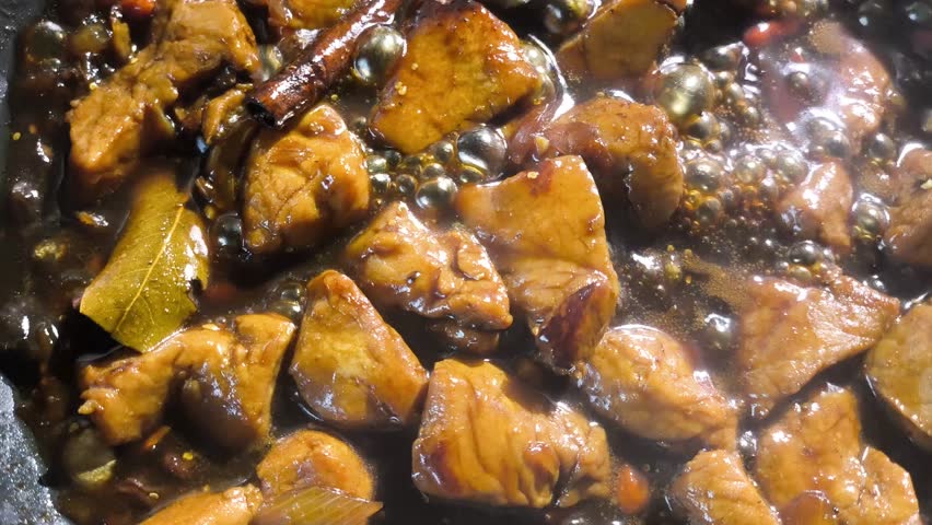 Stewing chopped pork with sauce in pan, in door  Chiangmai  Thailand.