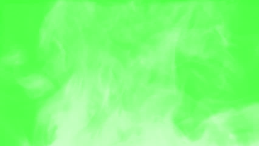 Steam Slowly Curls Over Hot Food. Chroma key. White Steam rises from a large pot that is behind the scenes. Green background