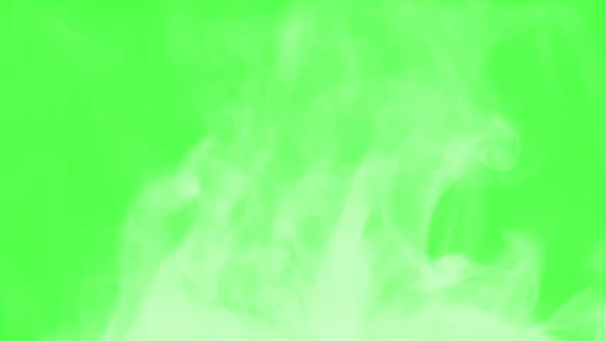 Steam Slowly Curls Over Hot Food. Chroma key. White Steam rises from a large pot that is behind the scenes. Green background