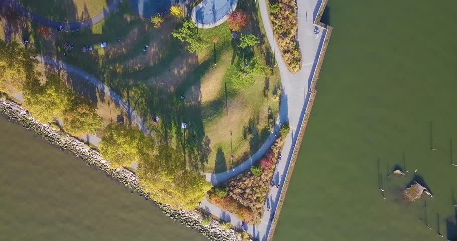 Aerial drone shot of a park at sunset.