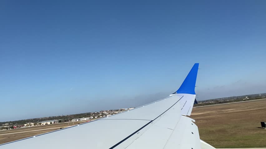 Airplane Taking Off Over San Antonio, Texas with Clear Sky