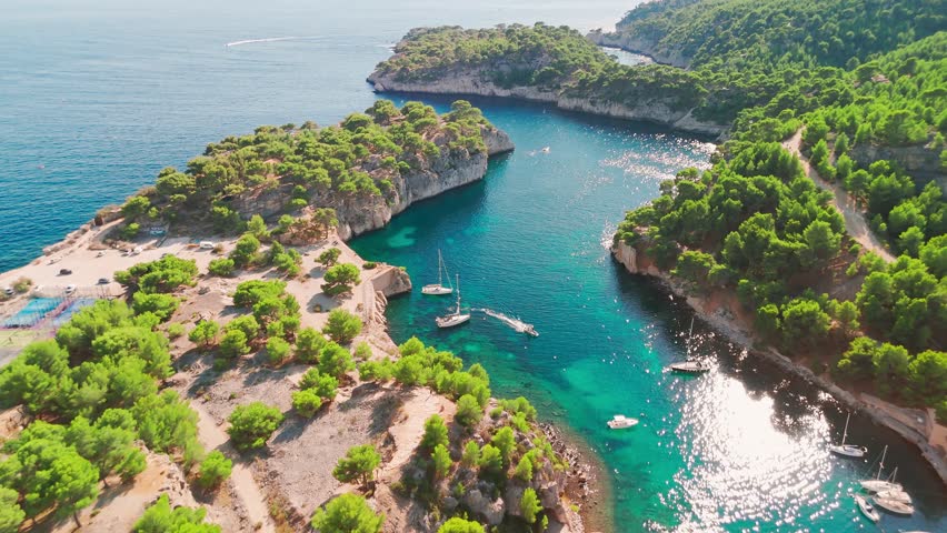 Aerial view of Calanque de Port Miou on the Mediterranean coast near Cassis Village, South of France. Part of Calanques National Park. Narrow fjord with lots of sail boats moored