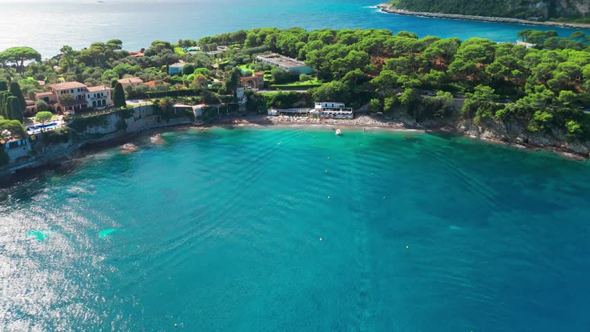 Aerial view of the Saint-Jean-Cap-Ferrat resort town on Cap Ferrat cape at French Riviera of Mediterranean Sea. Harbour of Saint Jean Cap Ferrat, France. Luxury travel destination in Cote dAzur