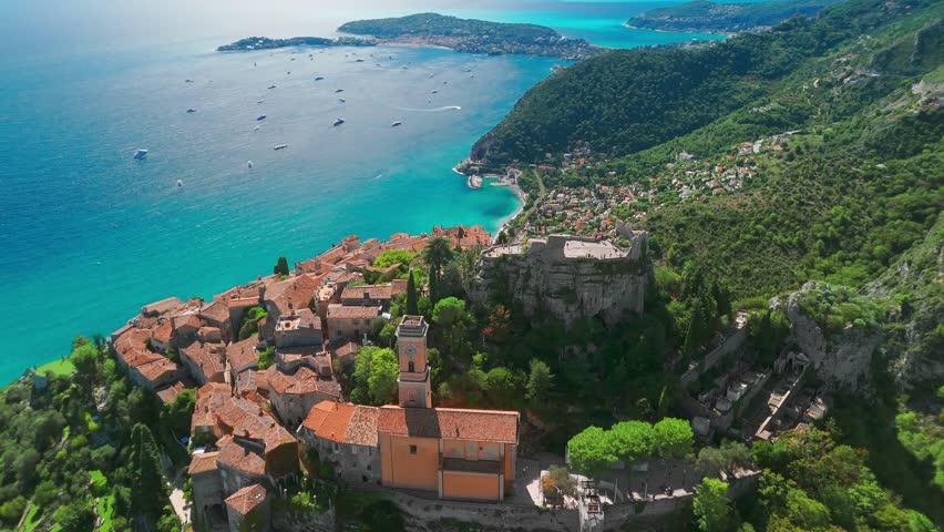 Aerial view of the medieval village of Eze on the Mediterranean coast, French Riviera, France. Historic town of Eze perched on a hilltop, surrounded by breathtaking landscapes and turquoise sea waters