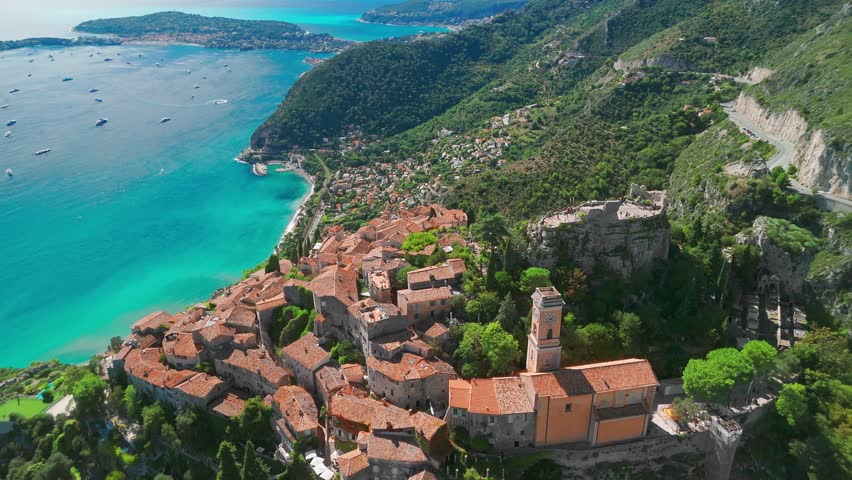 Aerial view of the medieval village of Eze on the Mediterranean coast, French Riviera, France. Historic town of Eze perched on a hilltop, surrounded by breathtaking landscapes and turquoise sea waters