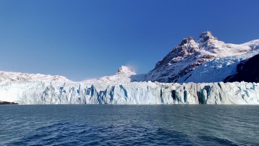 Patagonia Skyline At El Calafate Santa Cruz Argentina. Stunning View Of Icebergs Breaking Off Into The Water . Snowy Lake Patagonia Landscape Snowcapped. Snowy Forest Trees. El Calafate Santa Cruz.