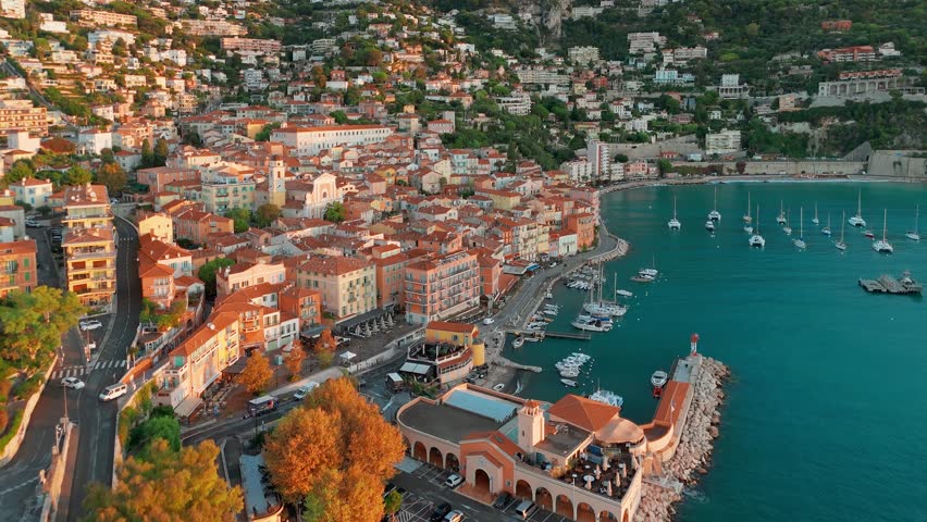 Aerial view of the picturesque town of Villefranche-sur-Mer at sunrise near Nice, Cote d'Azur, southern France. A popular summer travel destination on the French Riviera.