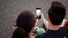 Happy smiling teenage friends laughing outside at something in smartphone or mobile phone. Three young multiracial people spending time together. Friendship, communication, youth and lifestyle concept - Powered by Shutterstock - Get 15% off with code: PIKWIZARD15