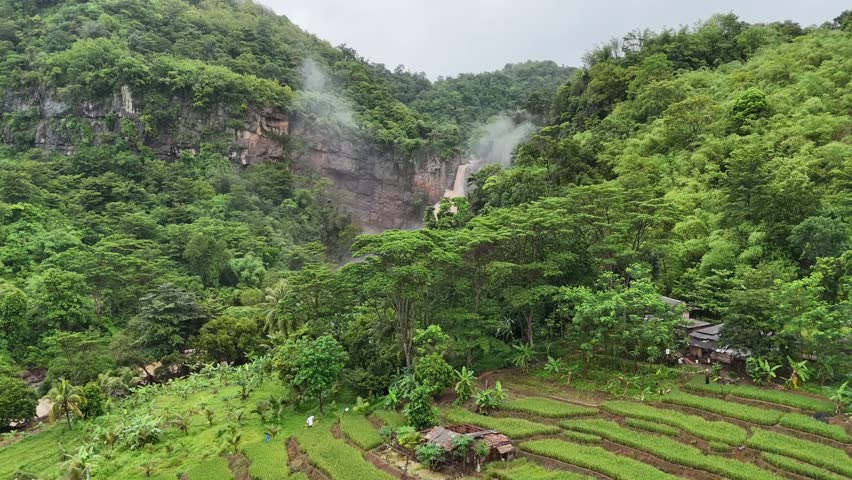 Amazing Waterfall in Sukabumi, a destination for many tourists as a place for recreation and photos. beautiful natural panorama of Waterfall Geopark Ciletuh
